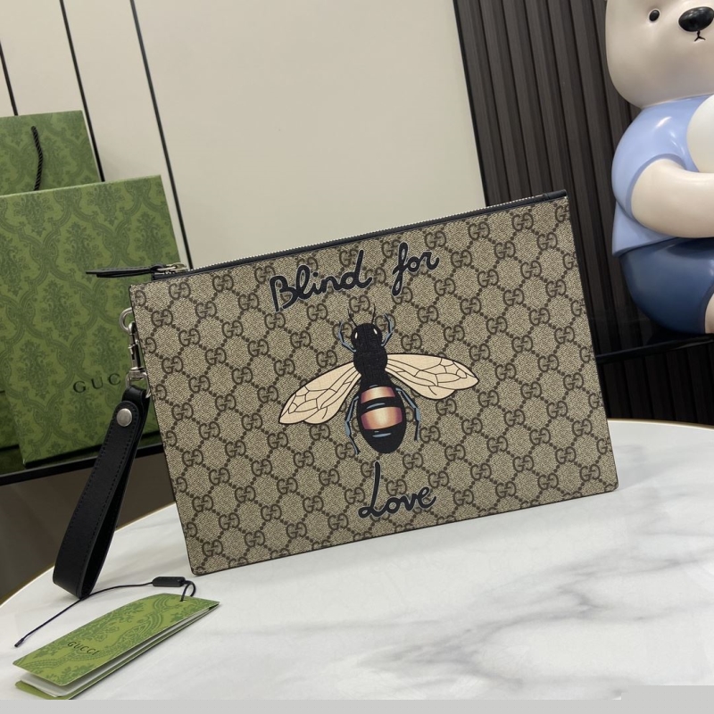 G*u*i clutch bags